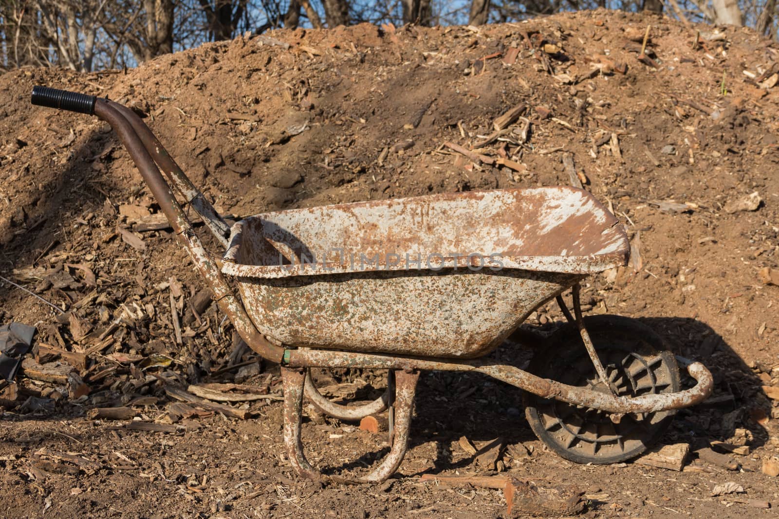 old and old wheelbarrow rust on the farm by GabrielaBertolini