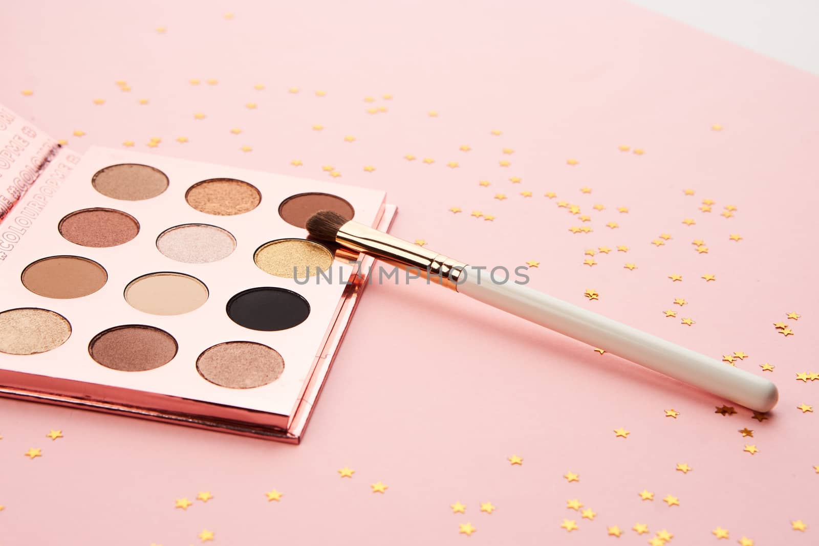 eyeshadow makeup brushes collection professional cosmetics accessories on pink background. High quality photo