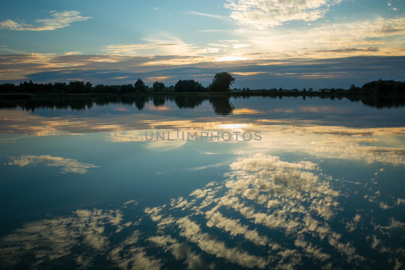 The reflection of clouds on the surface of the lake, summer view
