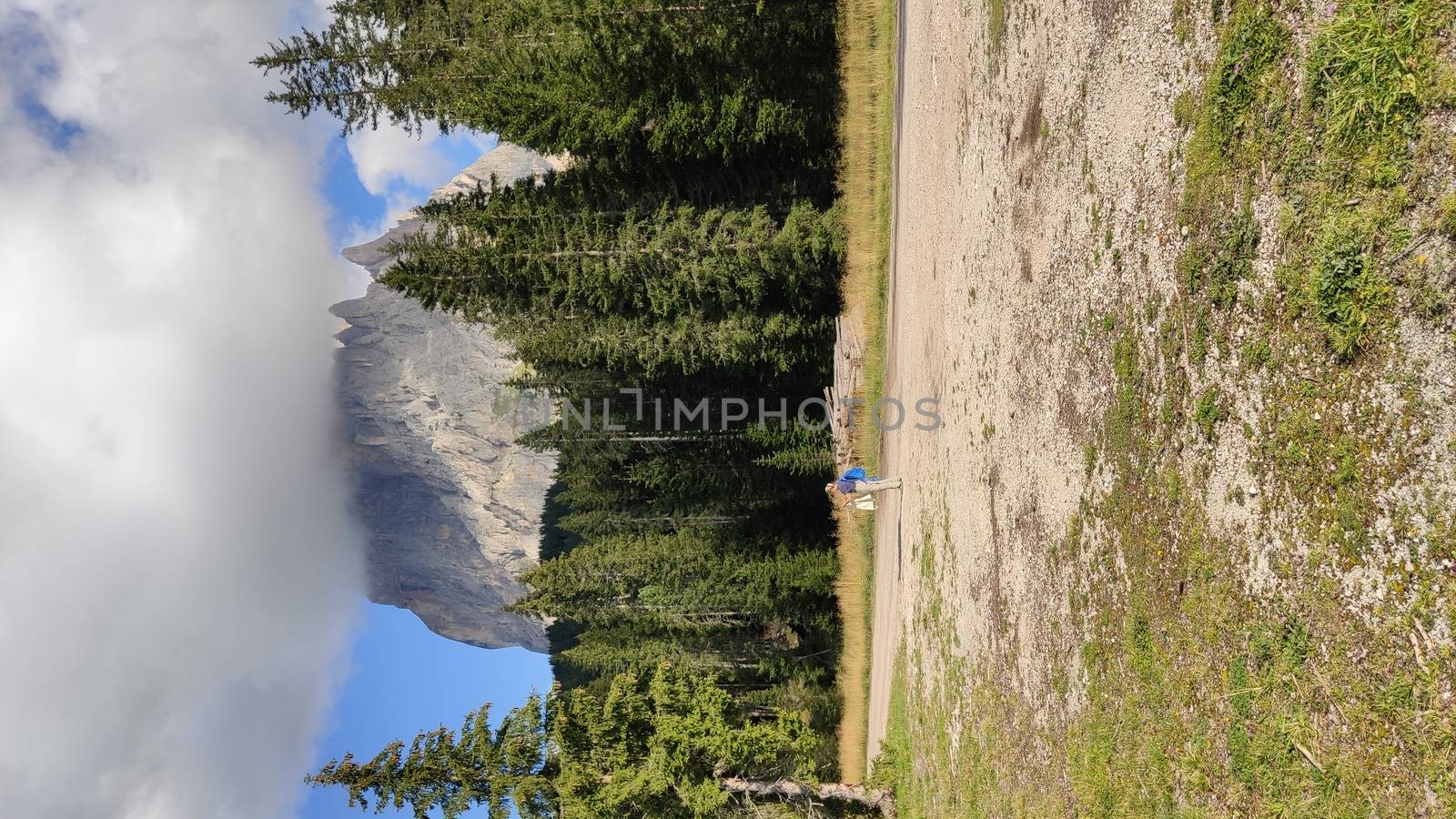 Val Gardena, Italy - 09/15/2020: Scenic alpine place with magical Dolomites mountains in background, amazing clouds and blue sky  in Trentino Alto Adige region, Italy, Europe