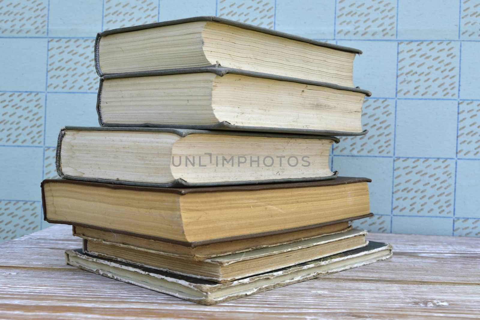 old books stacked on wooden table, retro interior
