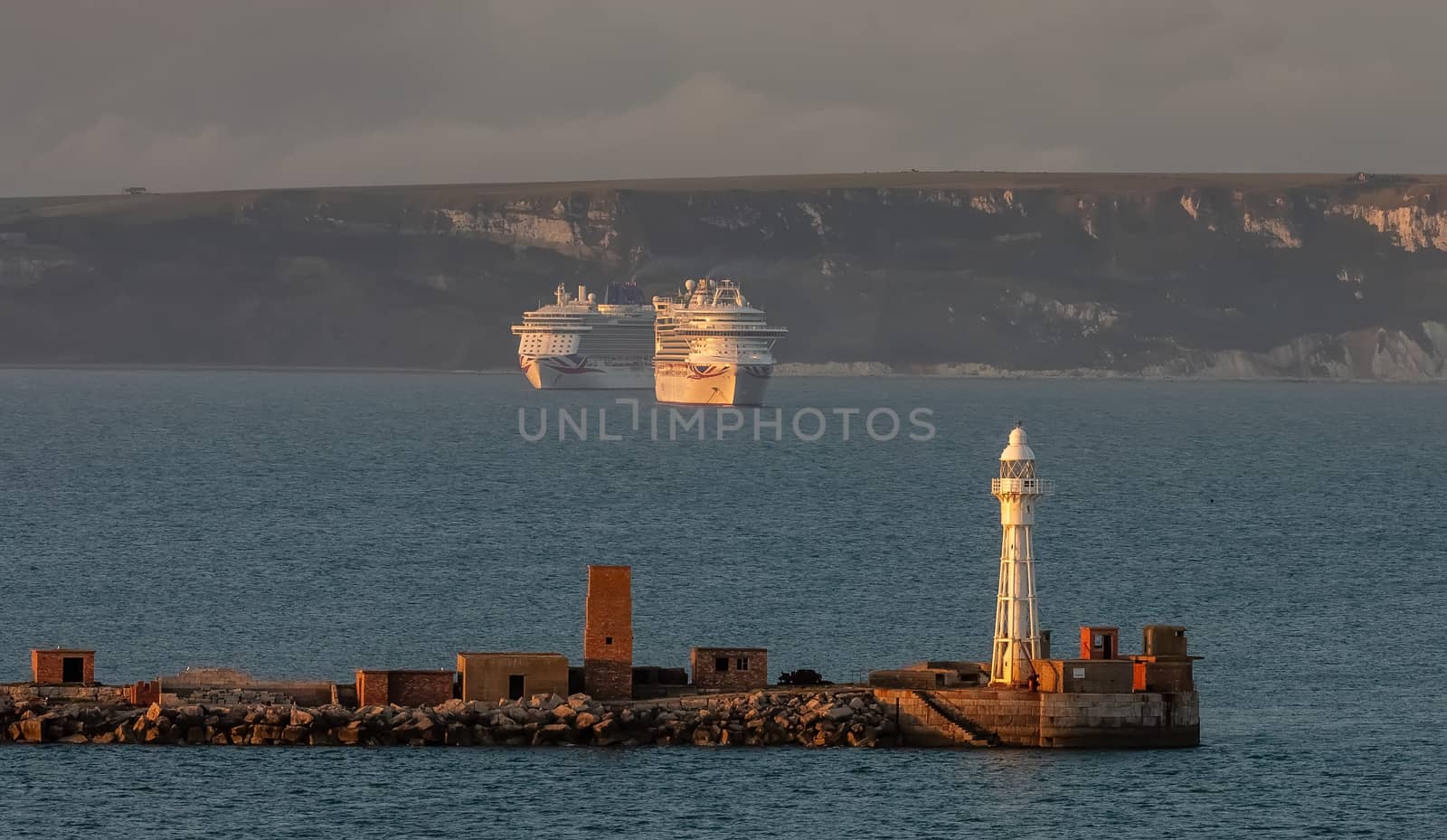 Portland harbour lighthouse with P&O cruiseships by DamantisZ