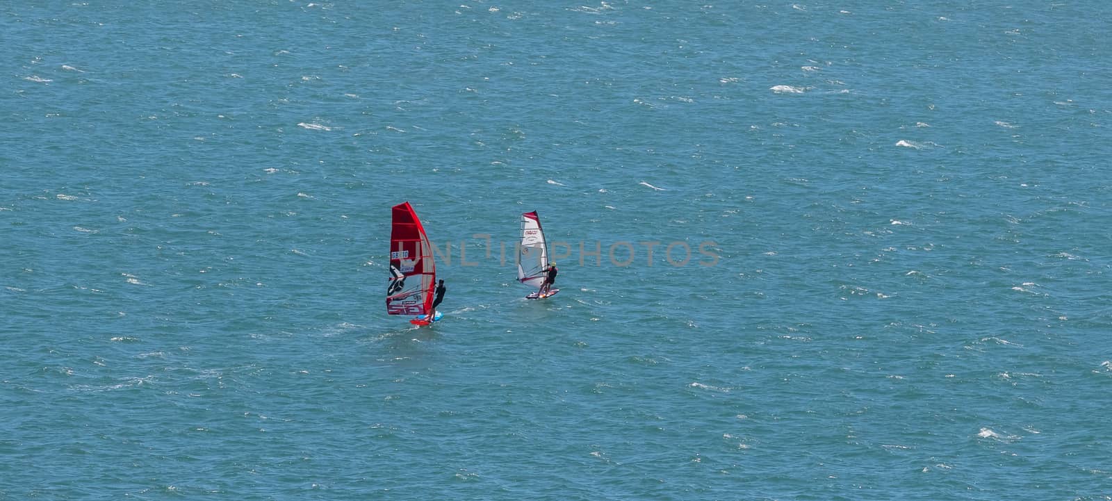 Shot of two sail boards with professional surfers by DamantisZ