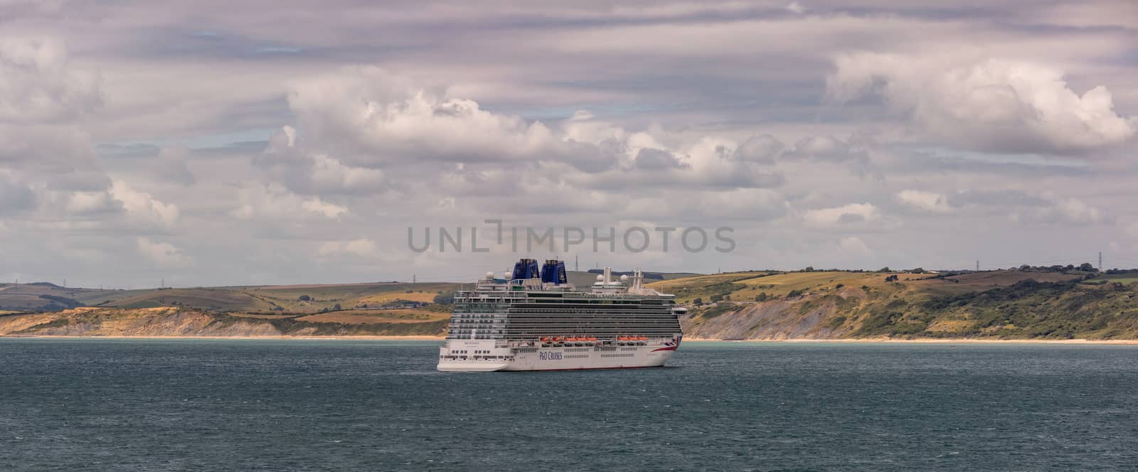 Weymouth Bay, United Kingdom - July 6, 2020: Beautiful panoramic shot of P&O cruise ship Britannia anchored in Weymouth Bay.