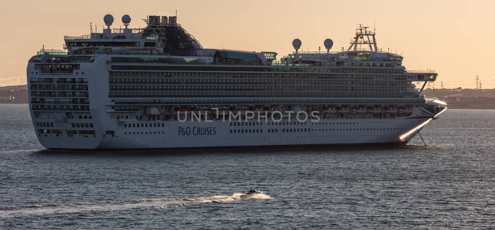 Weymouth Bay, United Kingdom - July 10, 2020: Beautiful panoramic shot of P&O cruise ship Ventura anchored in Weymouth Bay at sunset