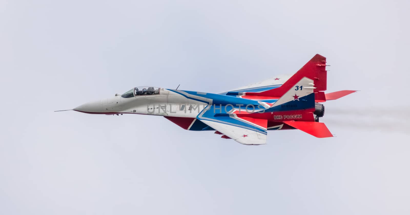 Barnaul, Russia - September 19, 2020: A close-up shot of Strizhi MiG-29 fighter jet performing stunts during an aeroshow.