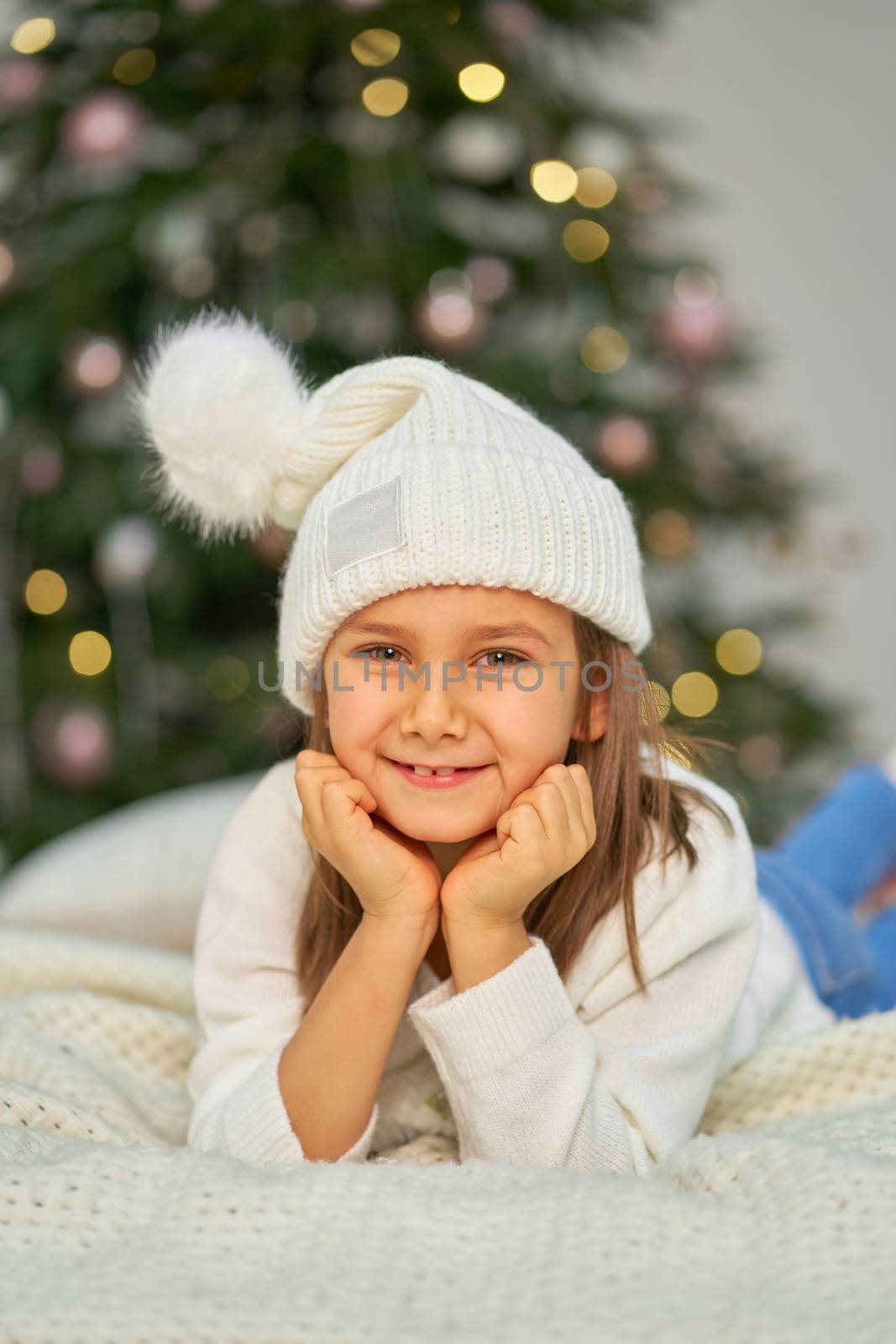 Happy childhood, Christmas magic fairy tale. Little girl waiting for Christmas and holiday gifts