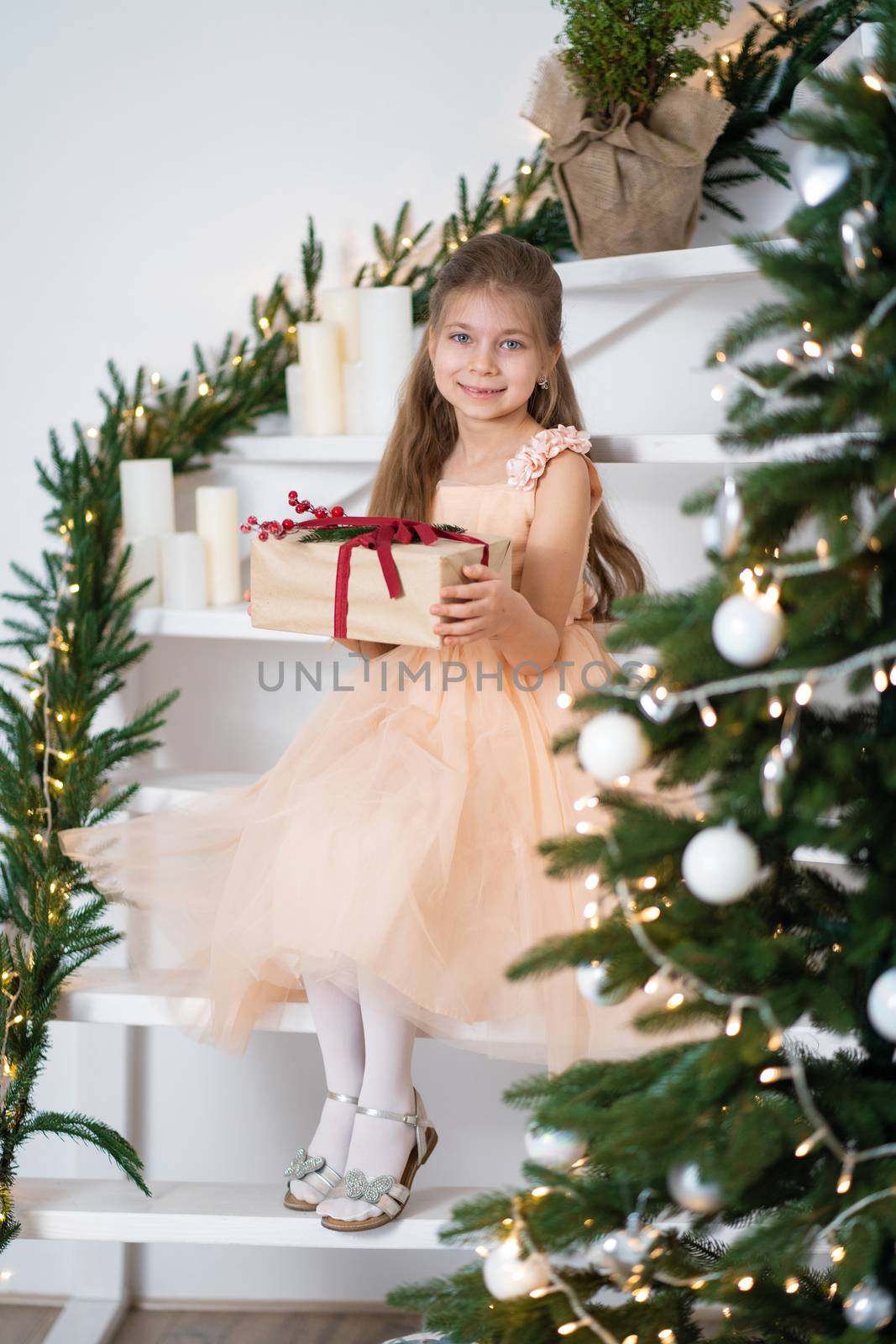 Little girl in princess dress celebrates christmas. Christmas magic fairy tale. Happy childhood by Try_my_best