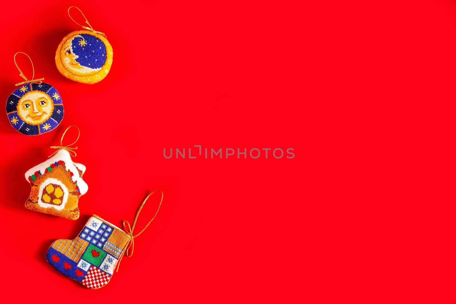 Christmas background with embroidered Christmas toys on red background, holiday, new year and Christmas concept
