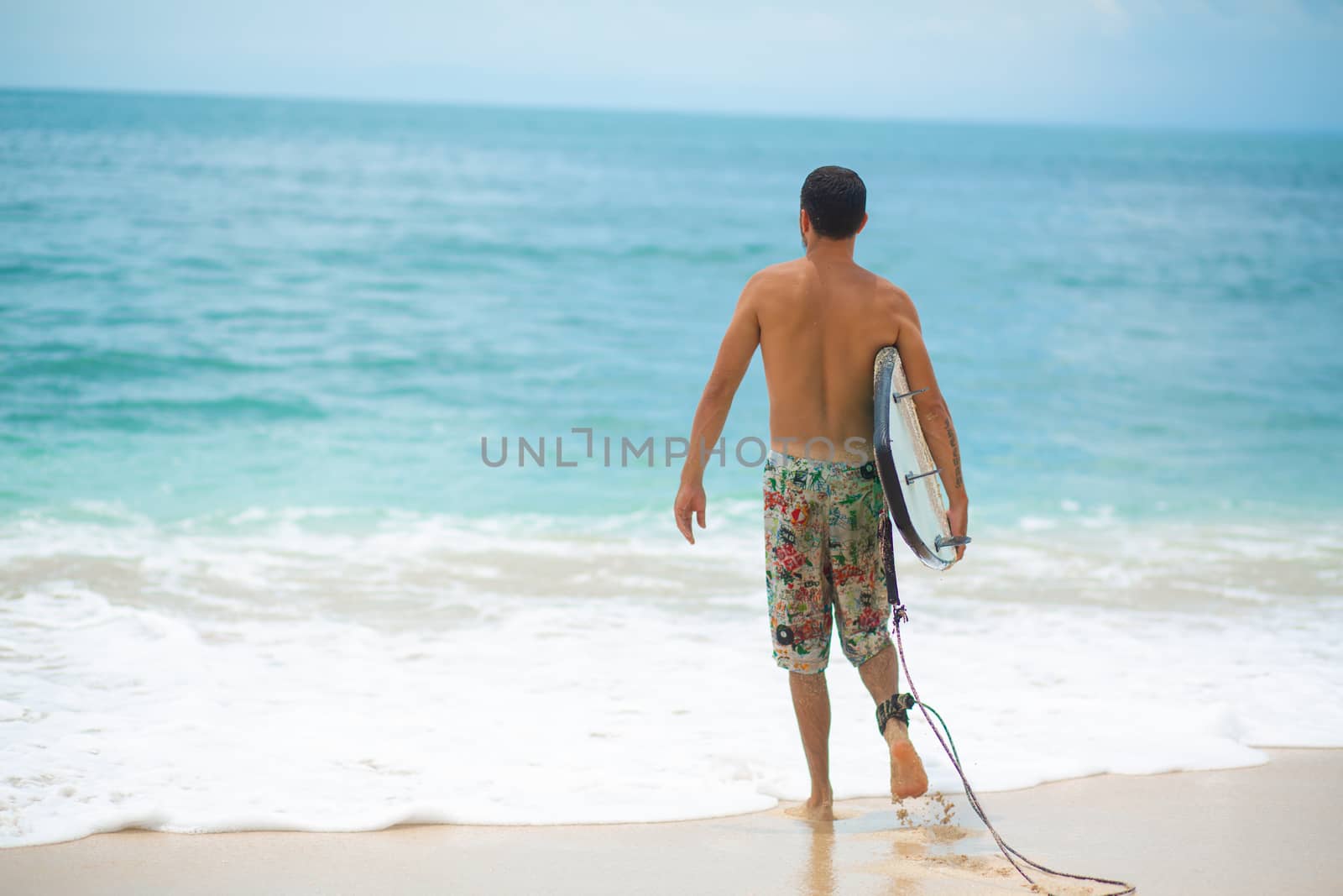 Surfer. Surfing Man With Surfboard Walking On Sandy tropical Beach. Healthy Lifestyle, water activities, Water Sport. Beautiful Ocean. by Try_my_best
