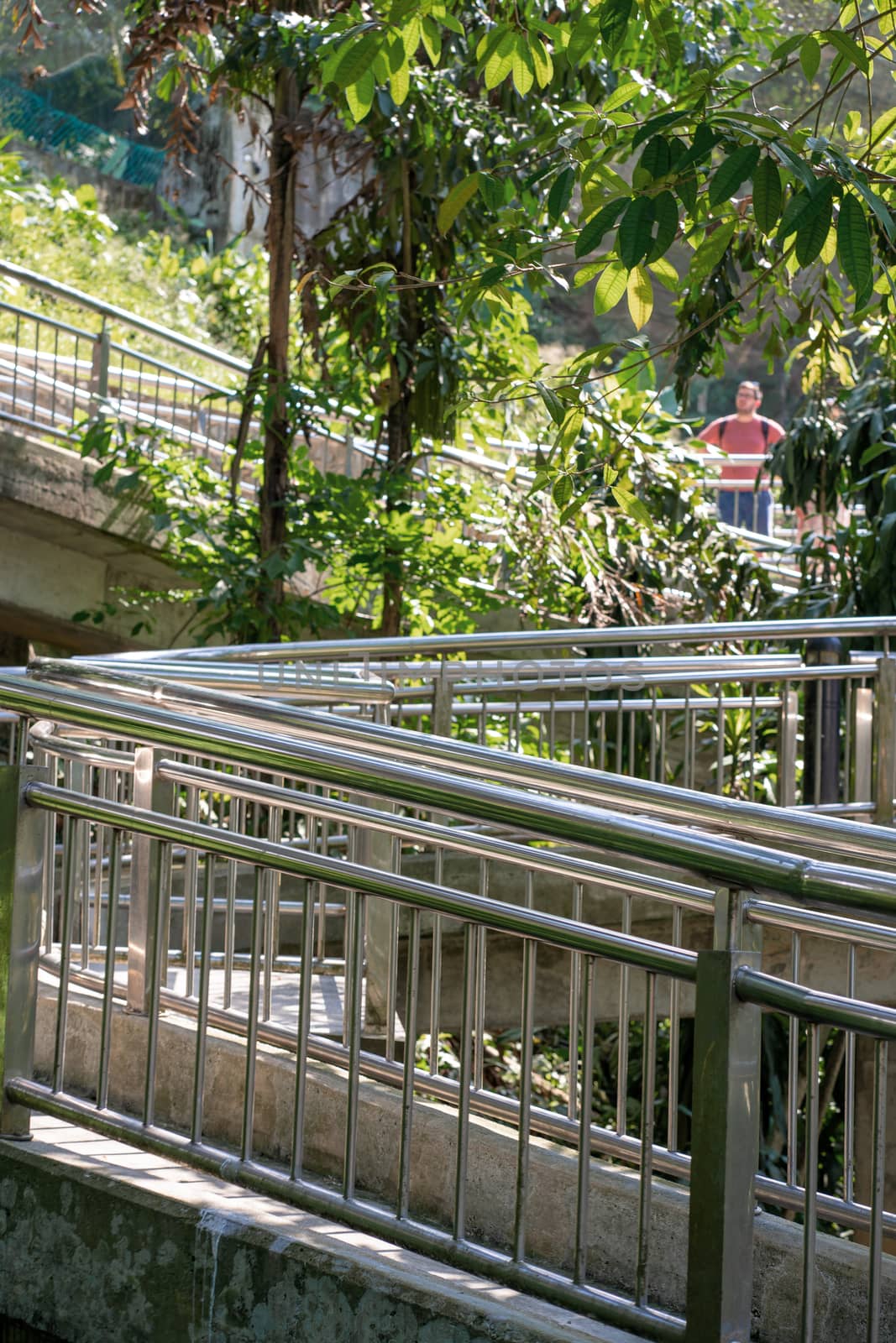 Stainless steel handrails, ramps in the city park. Leisure Park Architecture.