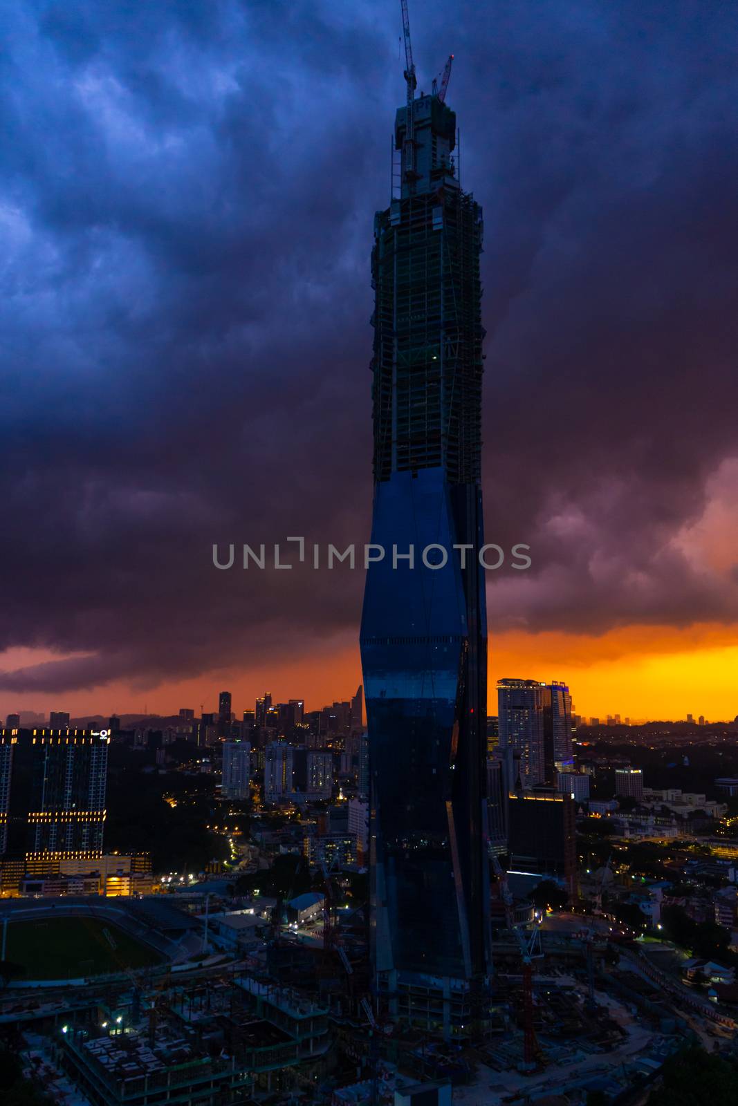 Stylish building under construction skyscraper KL 118 at sunset. Gorgeous views of the landscapes of Kuala Lumpur.