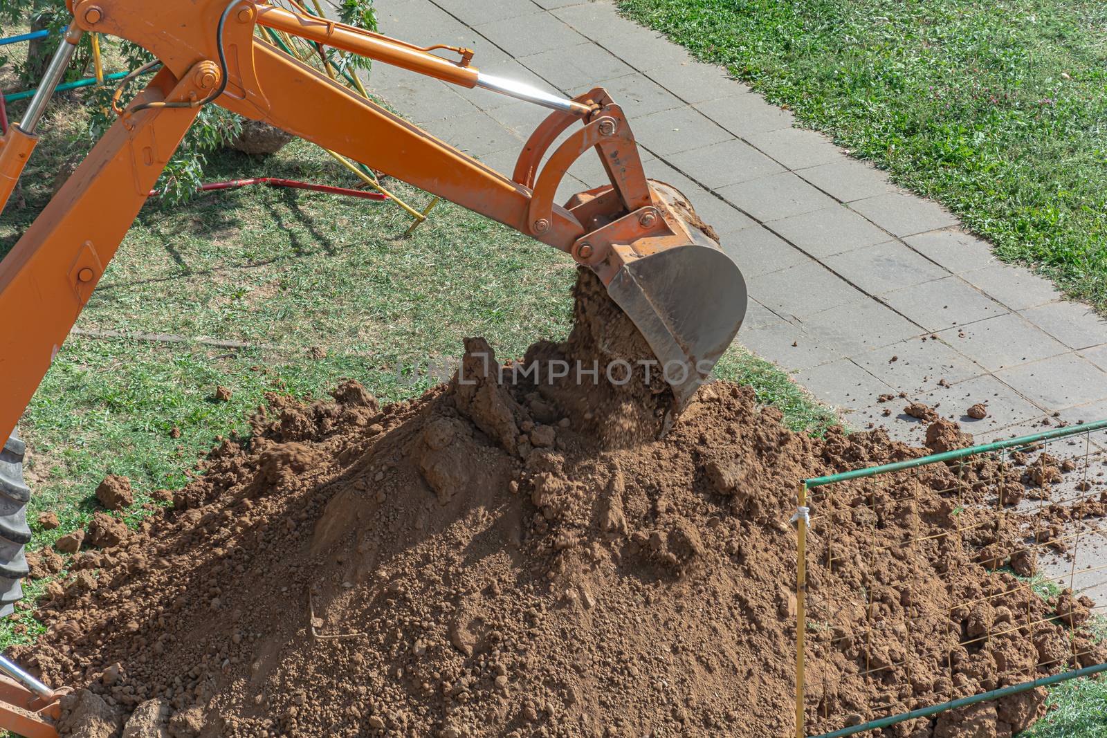 Minsk, Belarus - September 12: Tractor digs a pit to repair a ruptured heating pipe