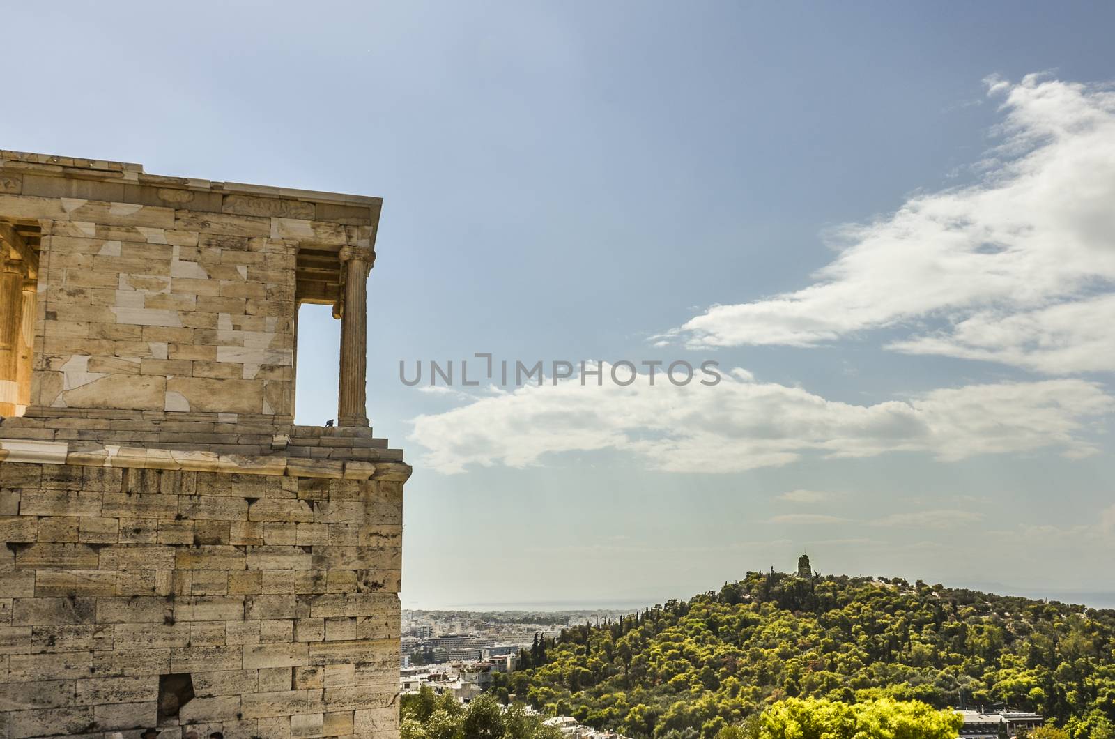 close-up view of the buildings of the Acropolis and behind the monument to Philopappos on the hill of the same name athens