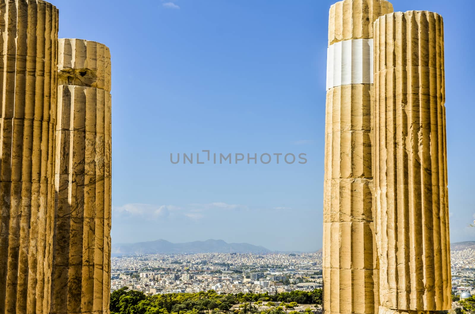 VIEW OF THE CITY OF ATHENS BETWEEN COLUMNS FROM THE ACROPOLIS