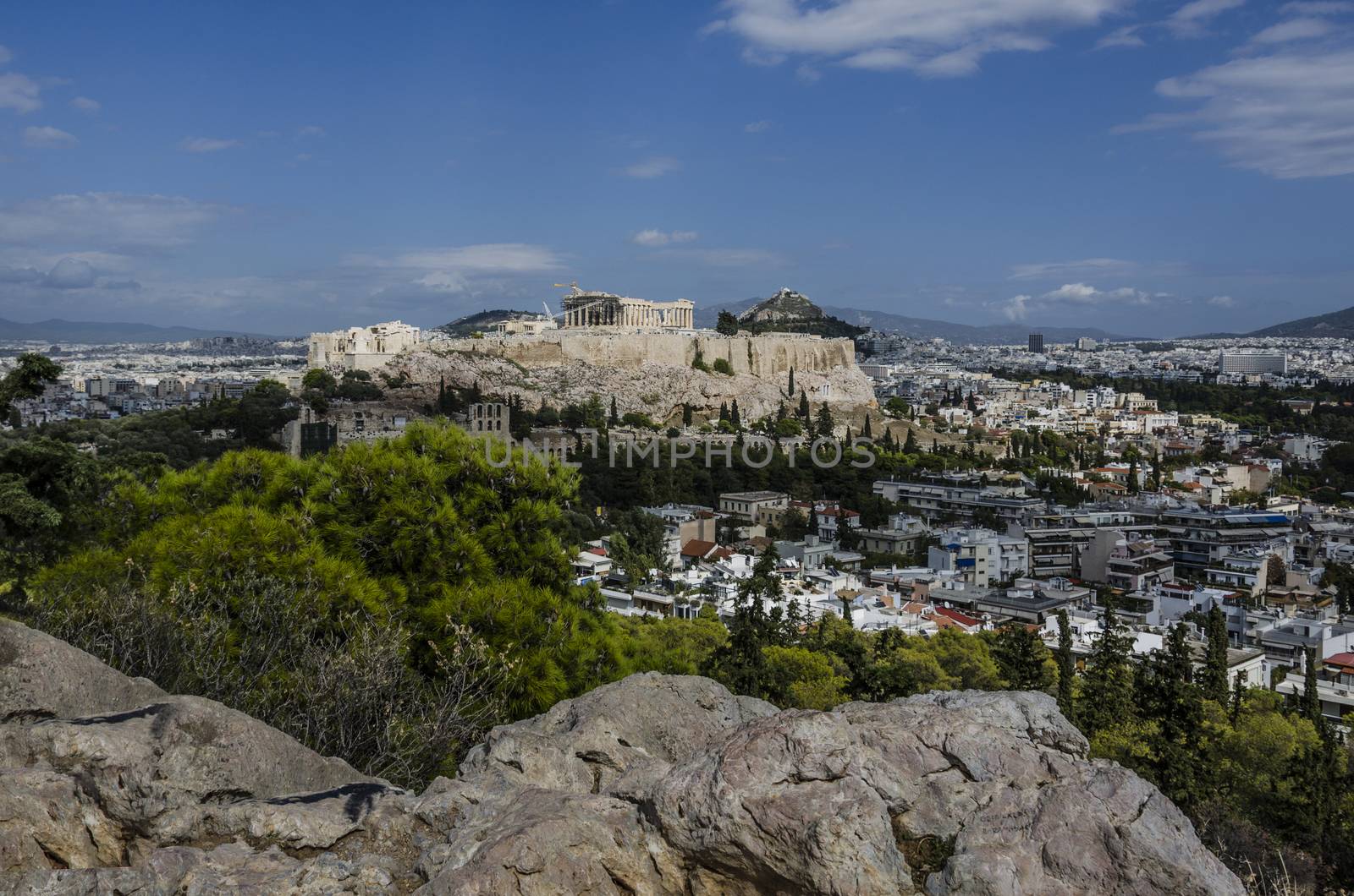 view from the philopappos hill of the acropolis and in the background the hill lycabettus