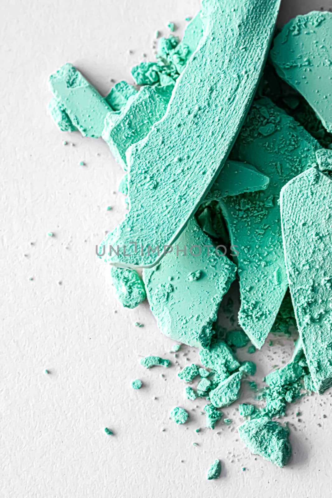 Mint eye shadow powder as makeup palette closeup isolated on white background, crushed cosmetics and beauty textures