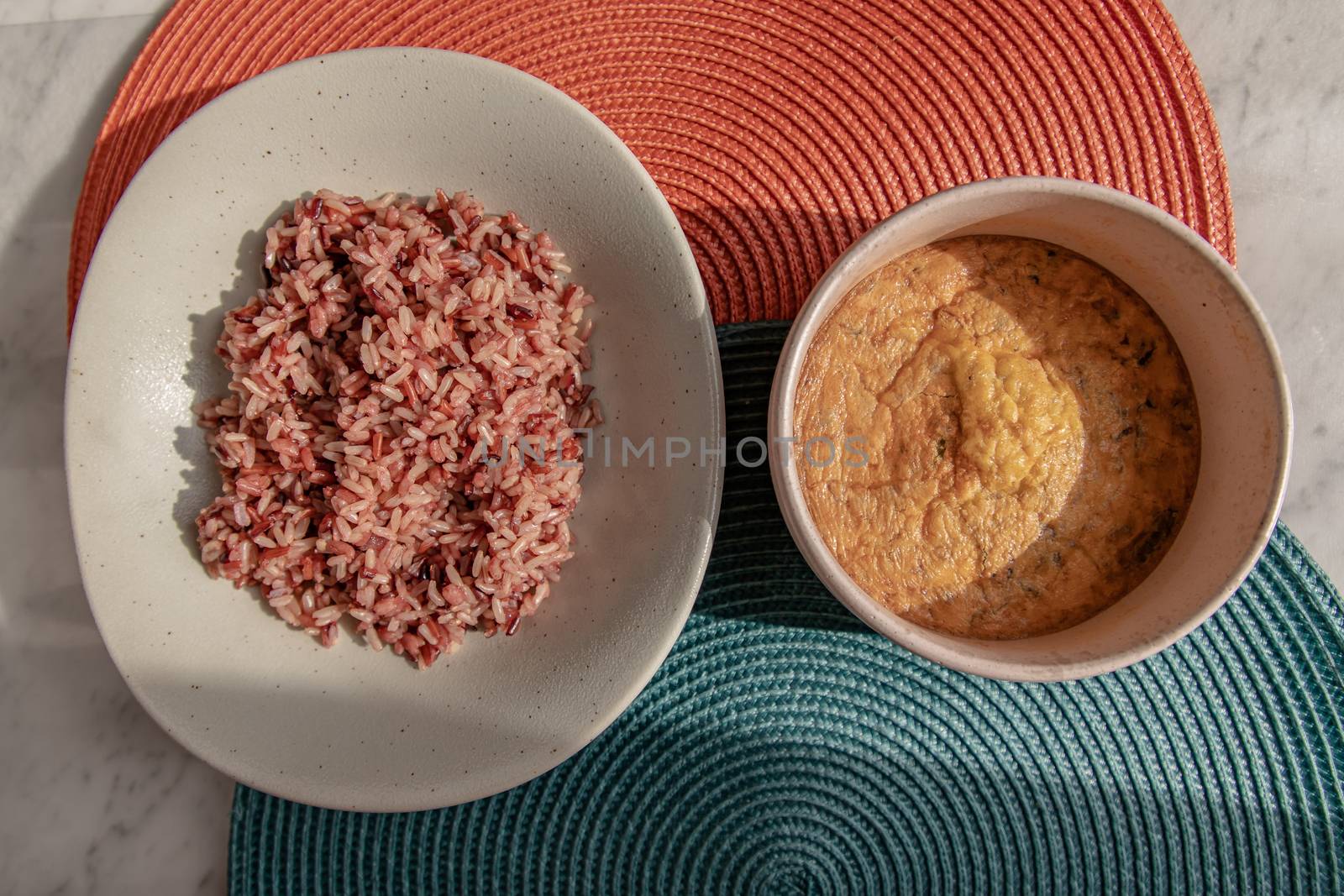 Riceberry with Omelet over marble table at morning. Top view, Selective focus. Healthy breakfast.