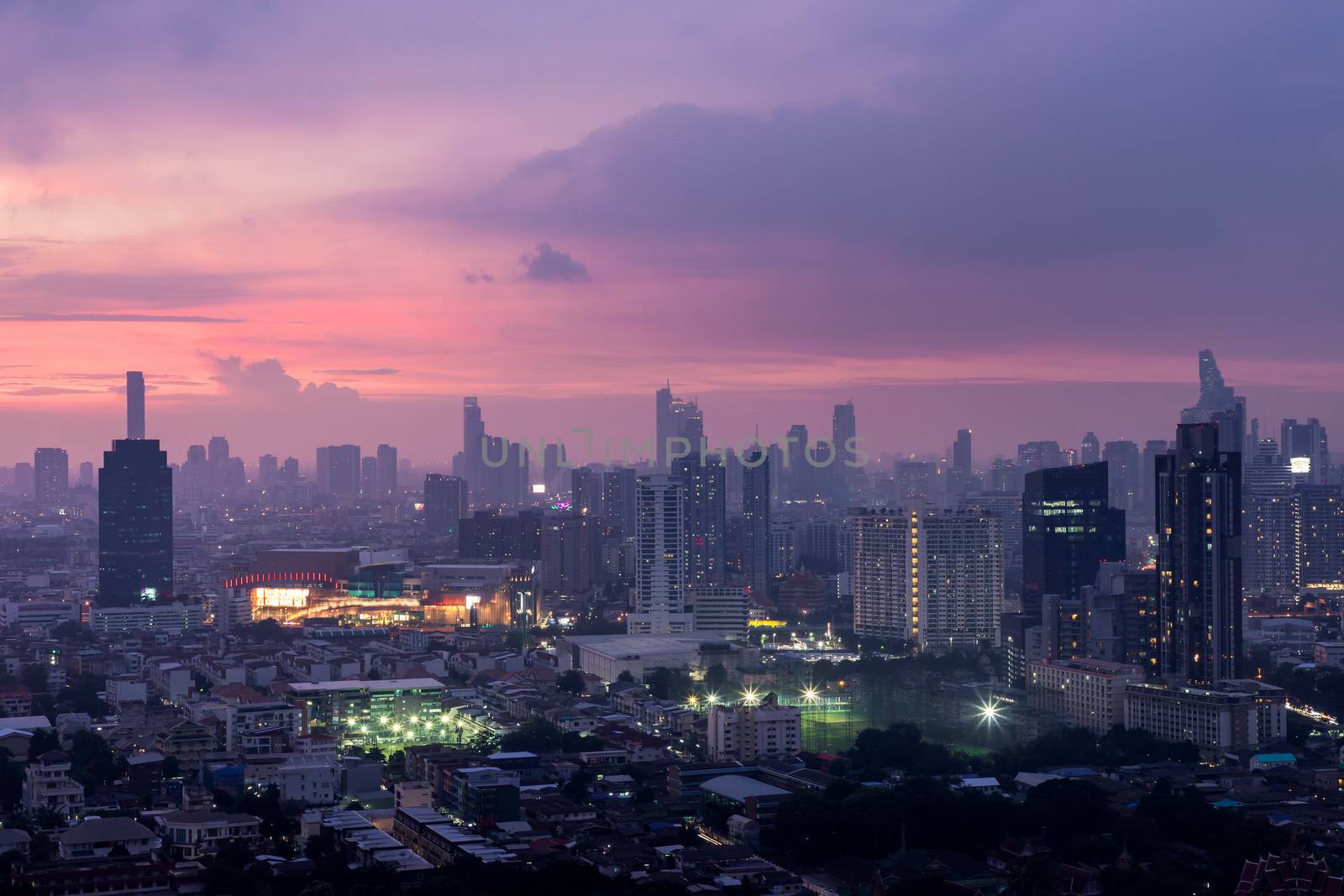 Bangkok downtown cityscape with skyscrapers at evening give the city a modern style. No focus, specifically.