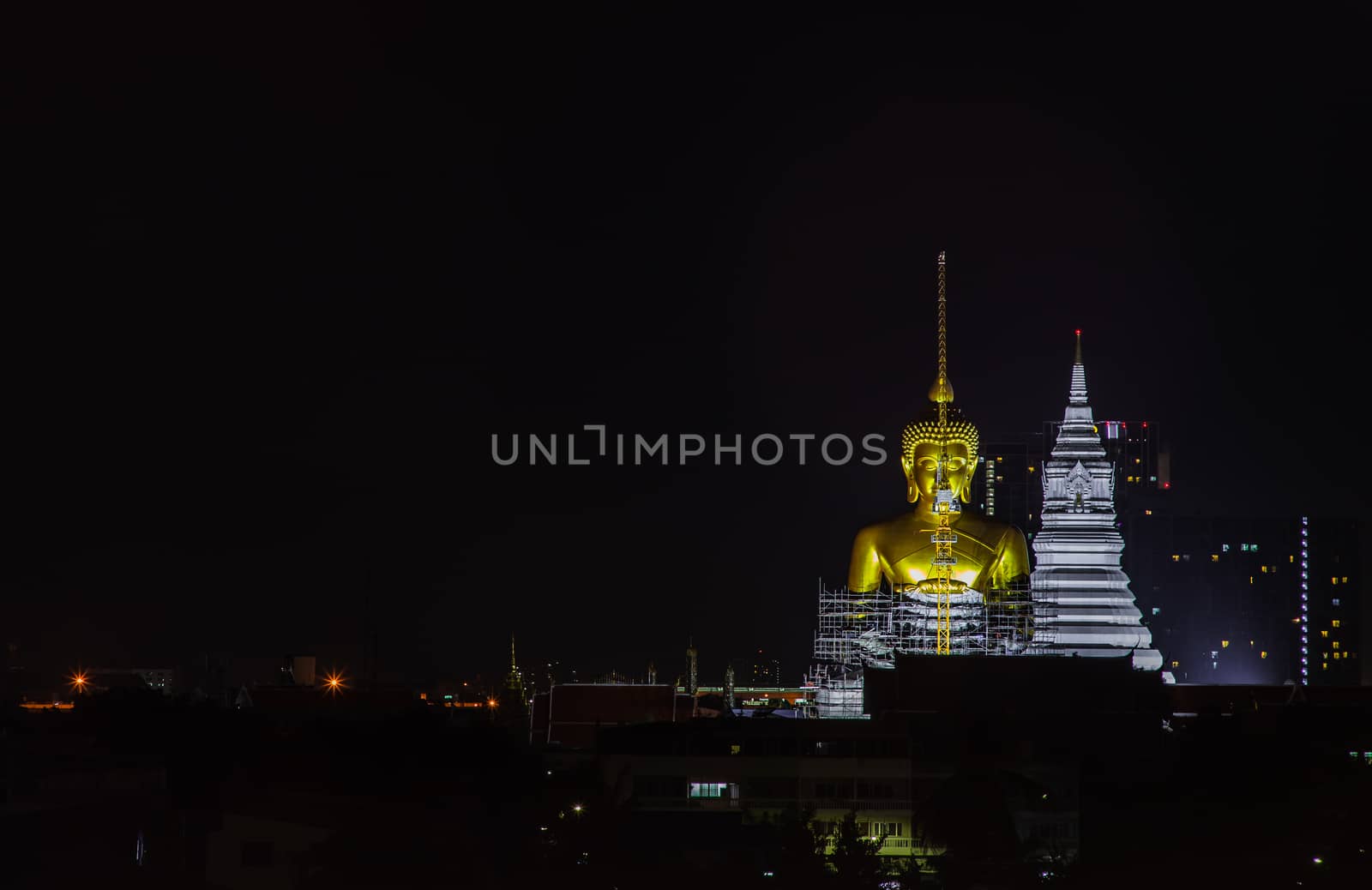 Bangkok, thailand - Sep 18, 2020 : Aerial view of Beautiful The Giant Golden Buddha in Wat Paknam Phasi Charoen Temple in Phasi Charoen district at night. Bangkok urban city, Thailand. Copy Space, Selective focus.