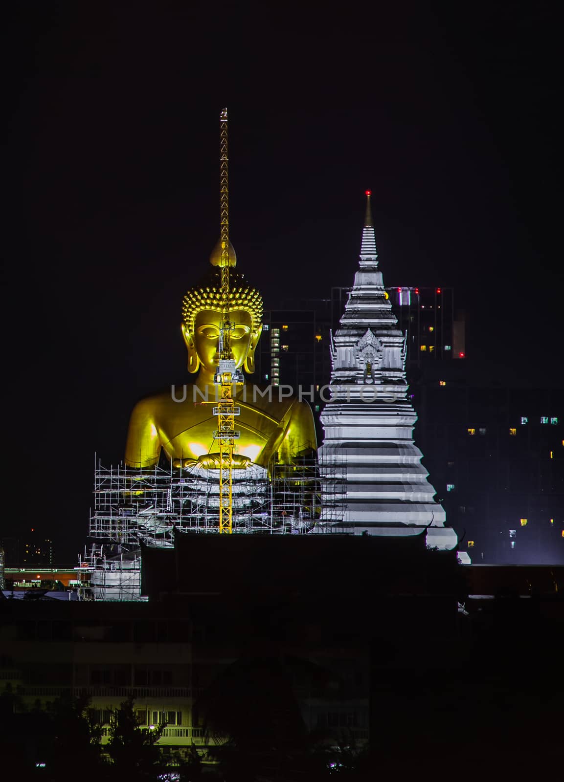 Bangkok, thailand - Sep 18, 2020 : Aerial view of Beautiful The Giant Golden Buddha in Wat Paknam Phasi Charoen Temple in Phasi Charoen district at night. Bangkok urban city, Thailand. Copy Space, Selective focus.