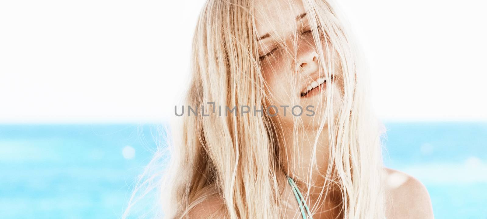 Woman with blond hair enjoying seaside and beach lifestyle in summertime, holiday travel and leisure by Anneleven