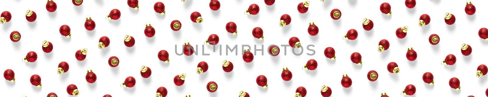 Christmas red decorations on white background. Christmas ornaments composition for background. Flat lay background madefrome red ornaments decorations