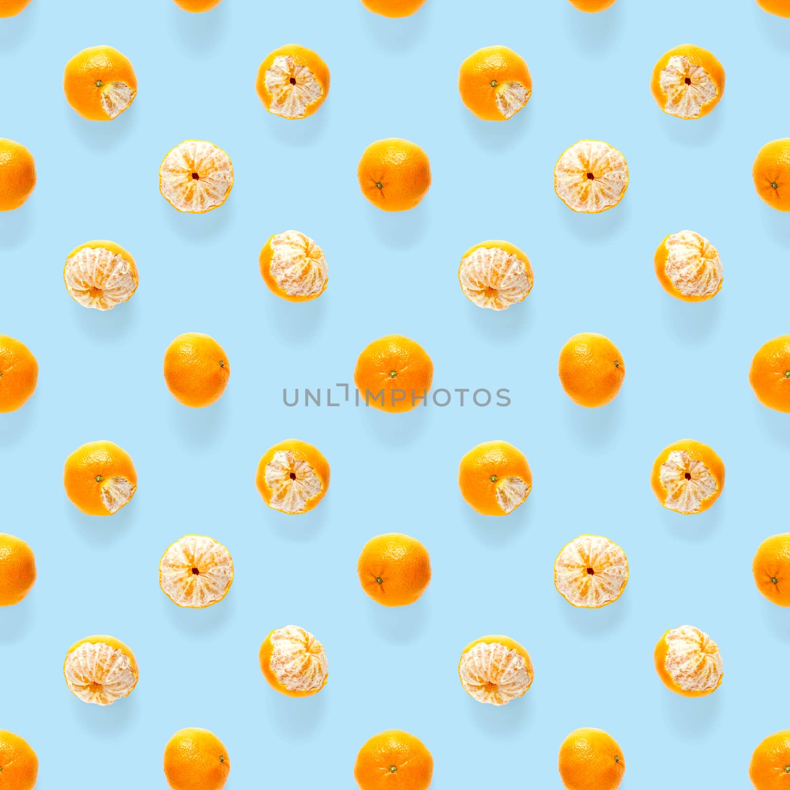 Fresh mandarin Seamles pattern. Ripe fruit tangerines seamless pattern. Fresh citrus isolated on blue background pattern. Flat lay of Clementine. Mandarine modern tropical seamless background.