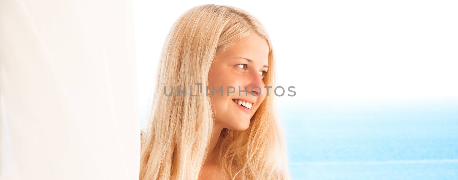 Woman with blond hair enjoying seaside and beach lifestyle in summertime, holiday travel and leisure by Anneleven