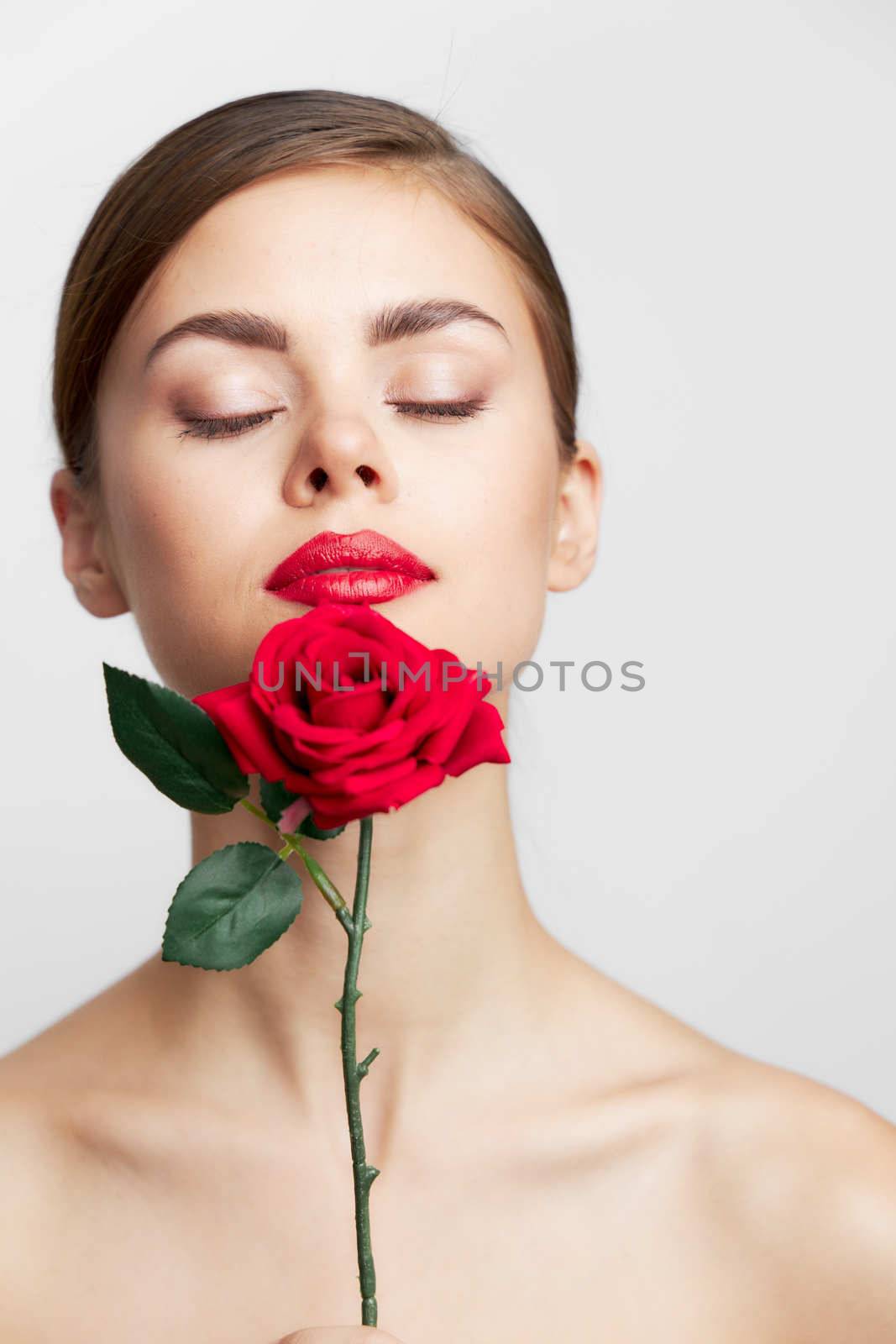 Lady with rose Closed eyes flower near the face cute face cropped view