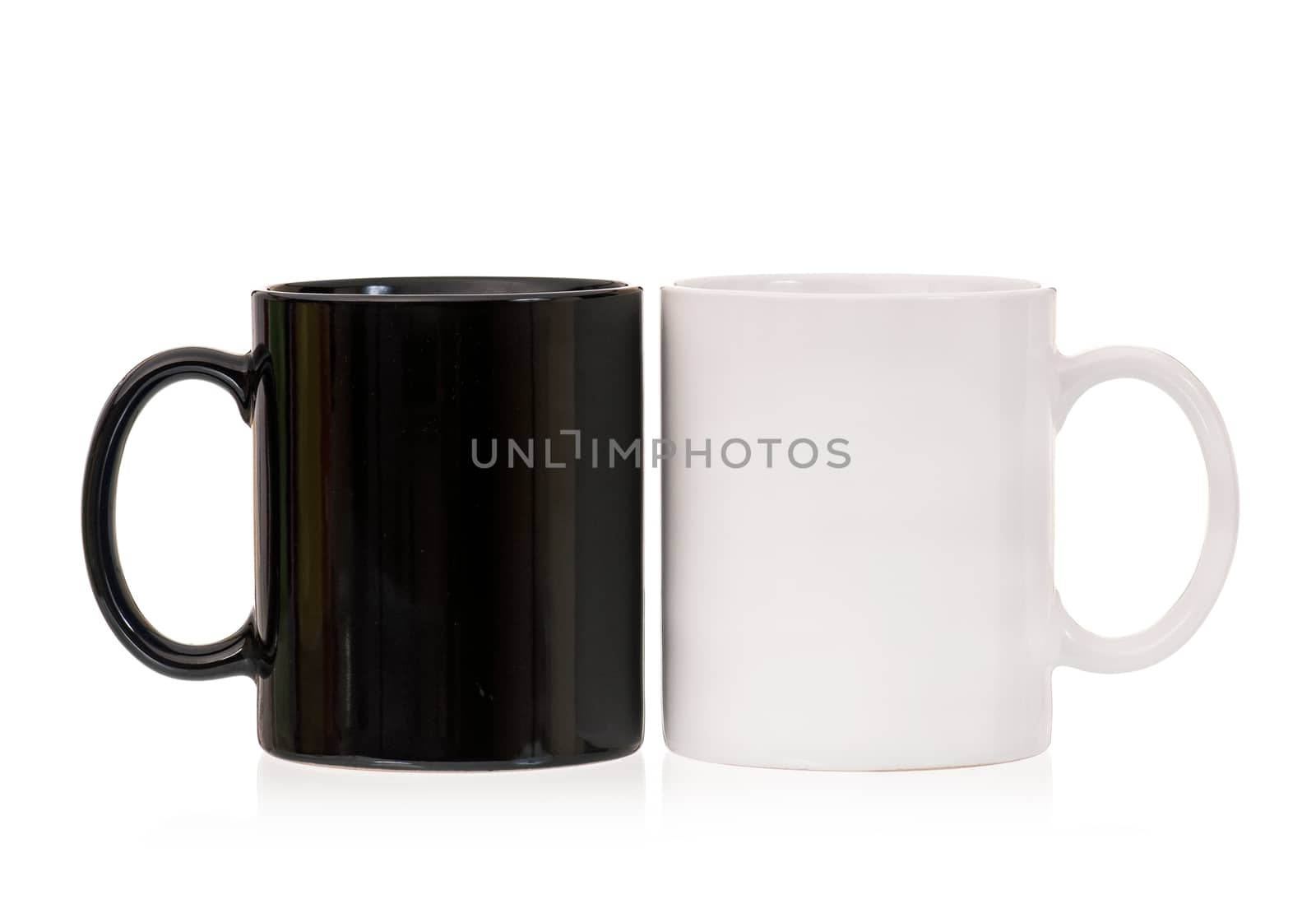 Two cups - white and black, isolated on white background