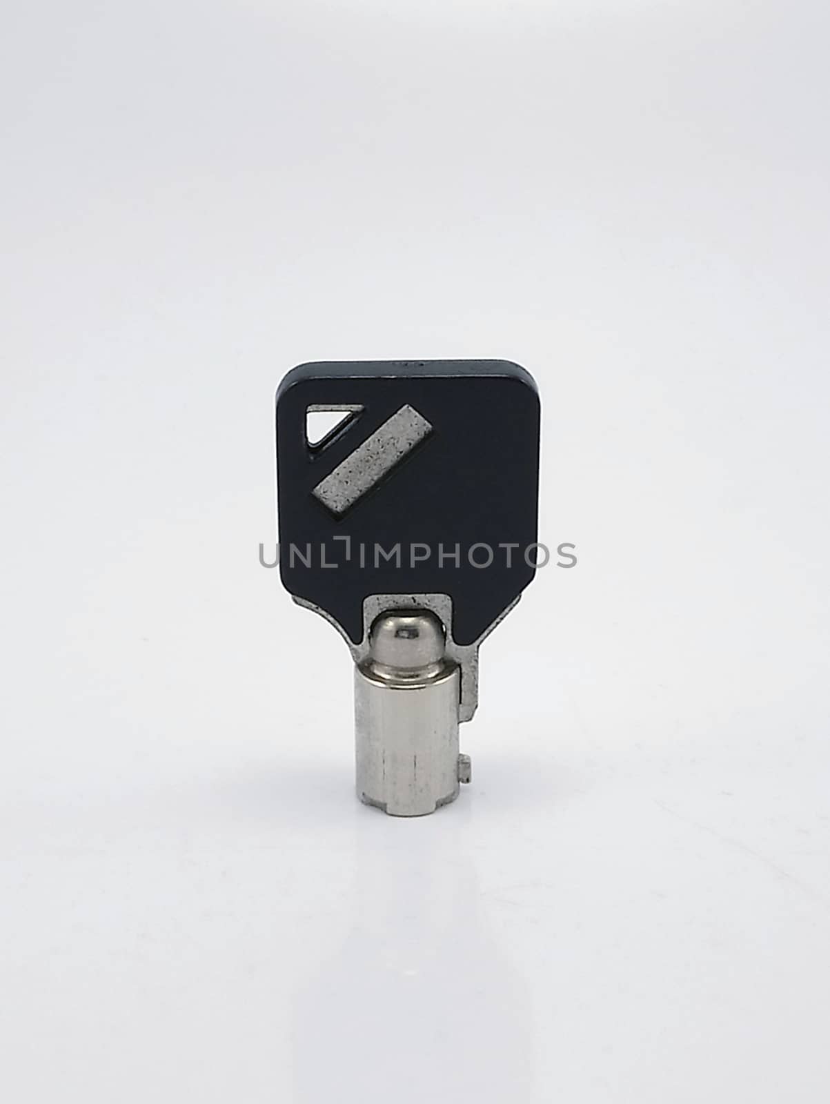 Tubular key use to lock and unlock things with black cover on top