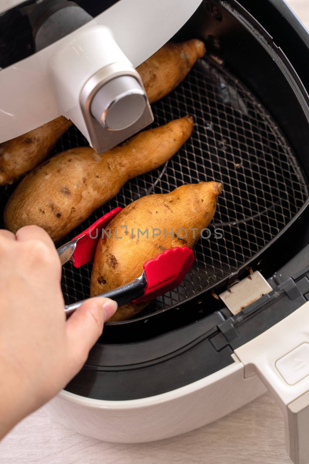 Roasted sweet potato cooked by airfryer at home. Healthy food for diet eating.