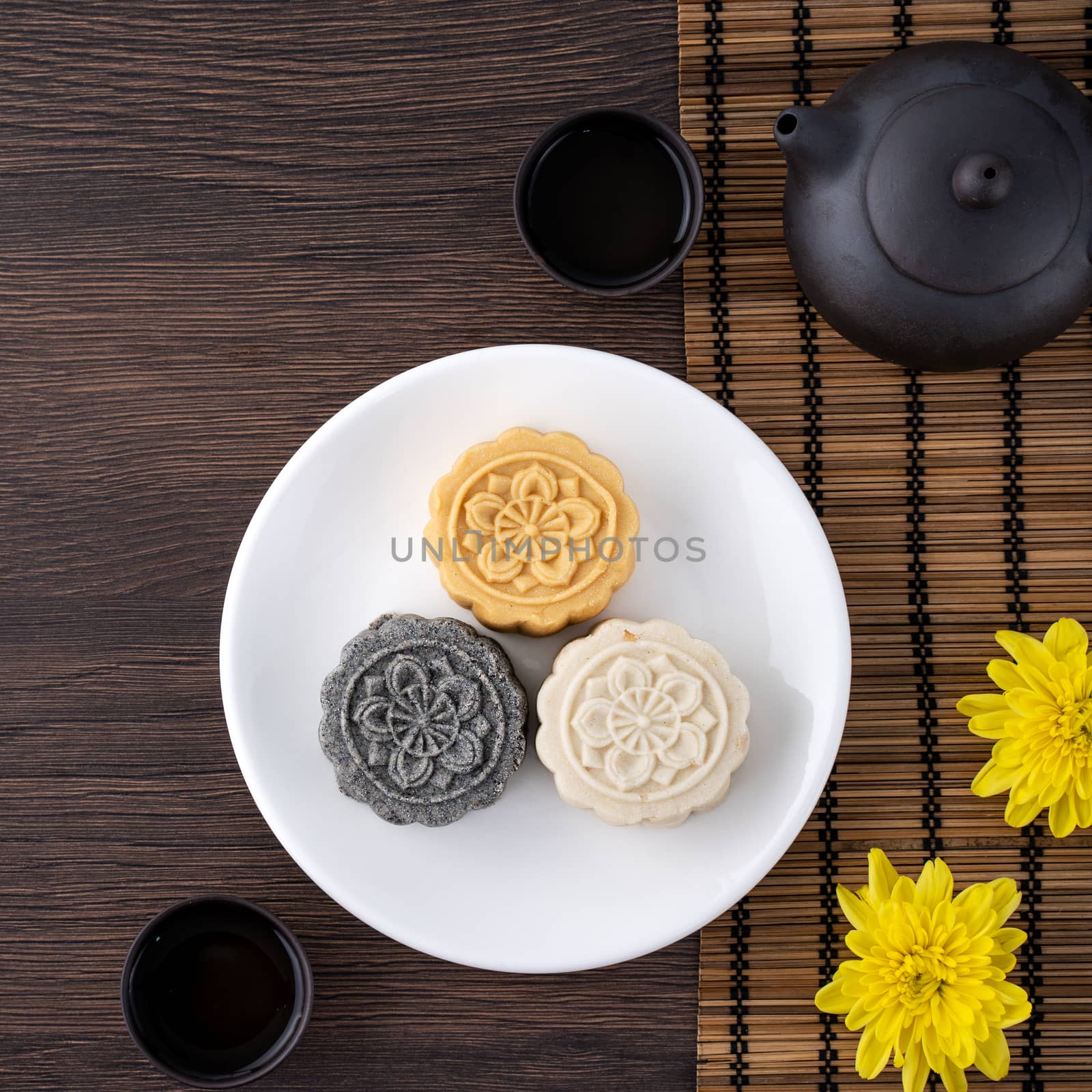 Colorful beautiful moon cake, mung bean cake, Champion Scholar Pastry cake for Mid-Autumn festival traditional gourmet dessert snack, top view, flat lay.