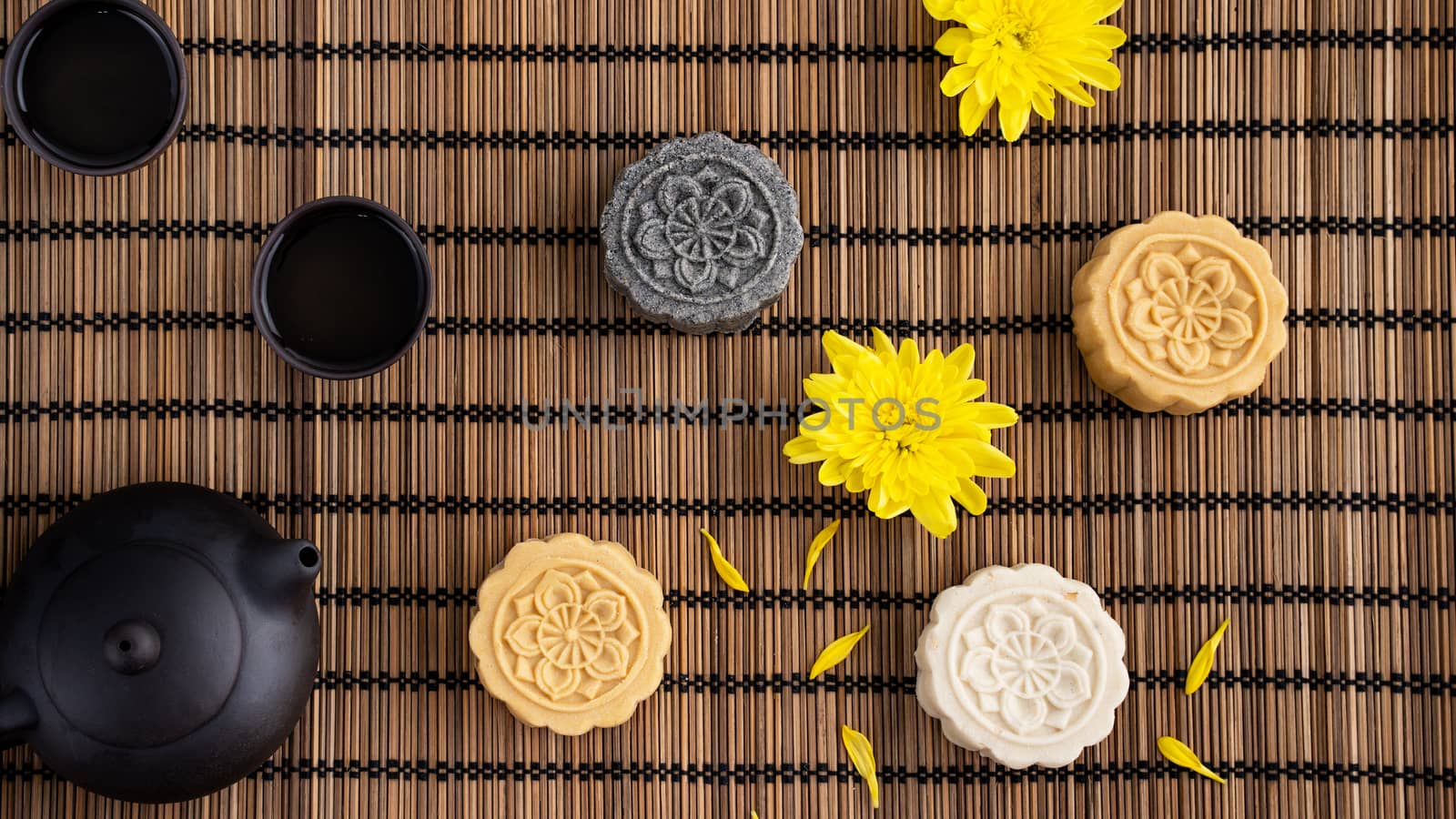 Colorful beautiful moon cake, mung bean cake, Champion Scholar Pastry cake for Mid-Autumn festival traditional gourmet dessert snack, top view, flat lay.