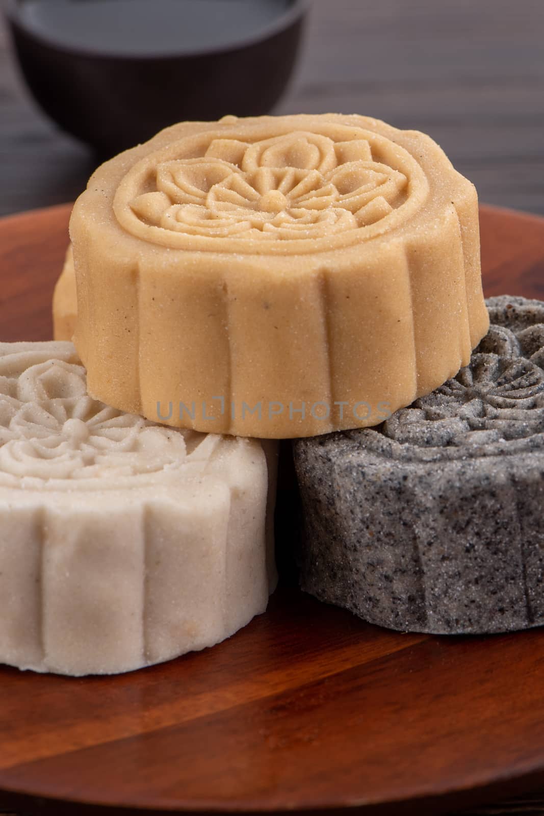 Colorful beautiful moon cake, mung bean cake, Champion Scholar Pastry cake for Mid-Autumn festival traditional gourmet dessert snack, close up.