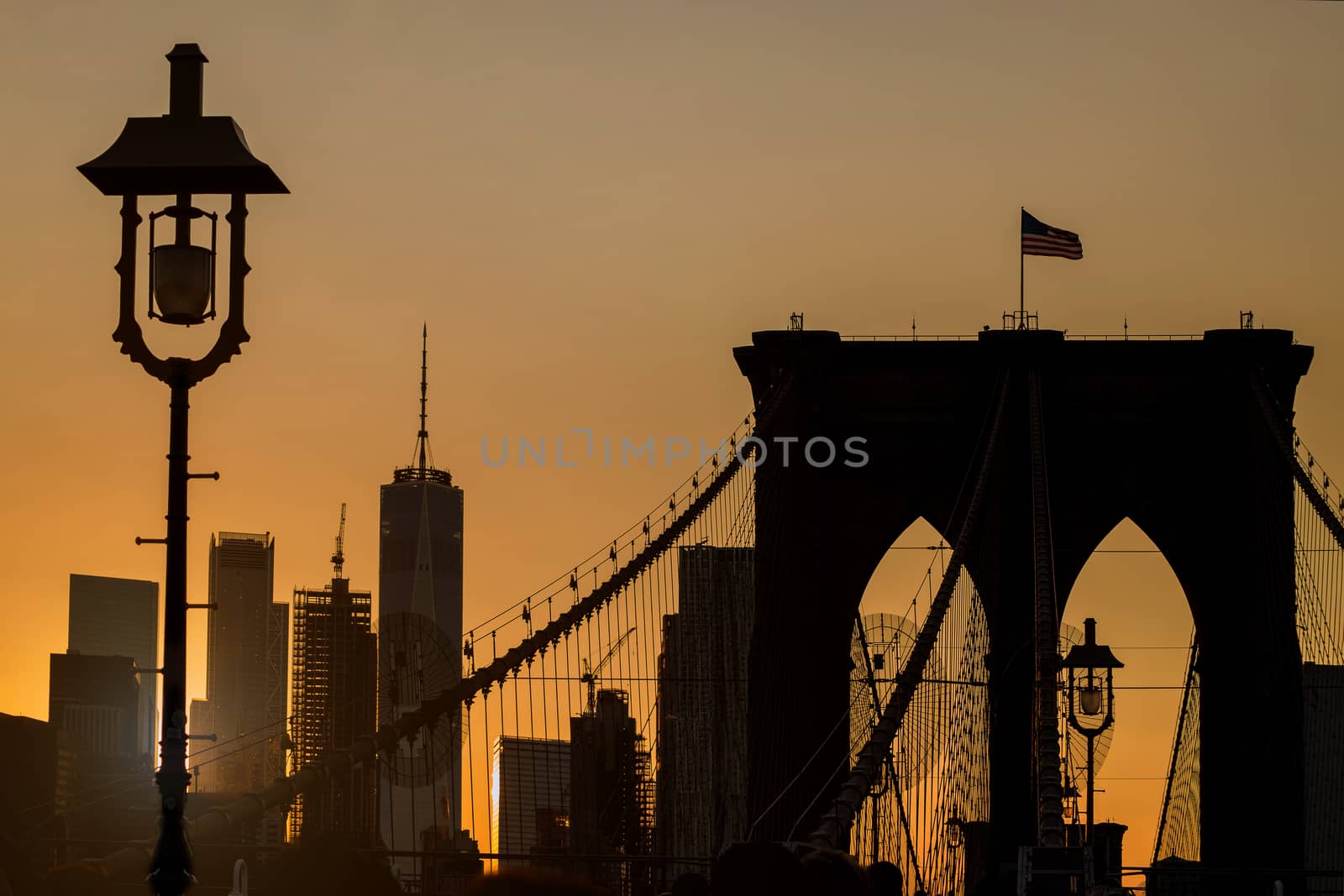 NYC Brooklyn Bridge skyline Manhattan at beautiful summer sunset. by ungvar