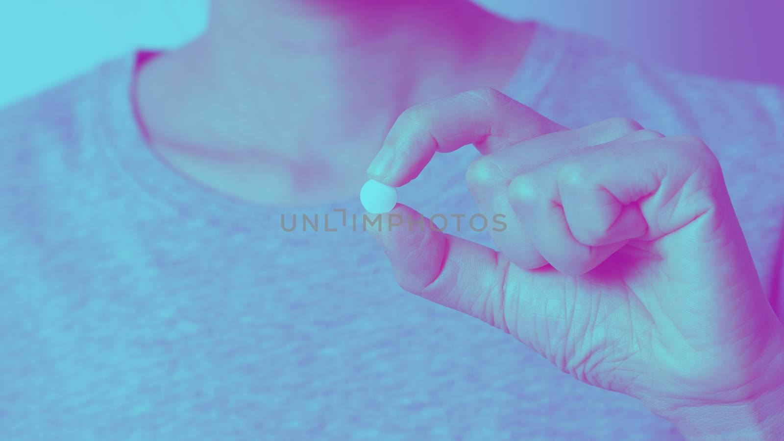 Close-up images of people taking or holding a medicine pill in hand which help and protect from pandemic virus and relief them from unhealthy and sickness. studio shot and clear background.