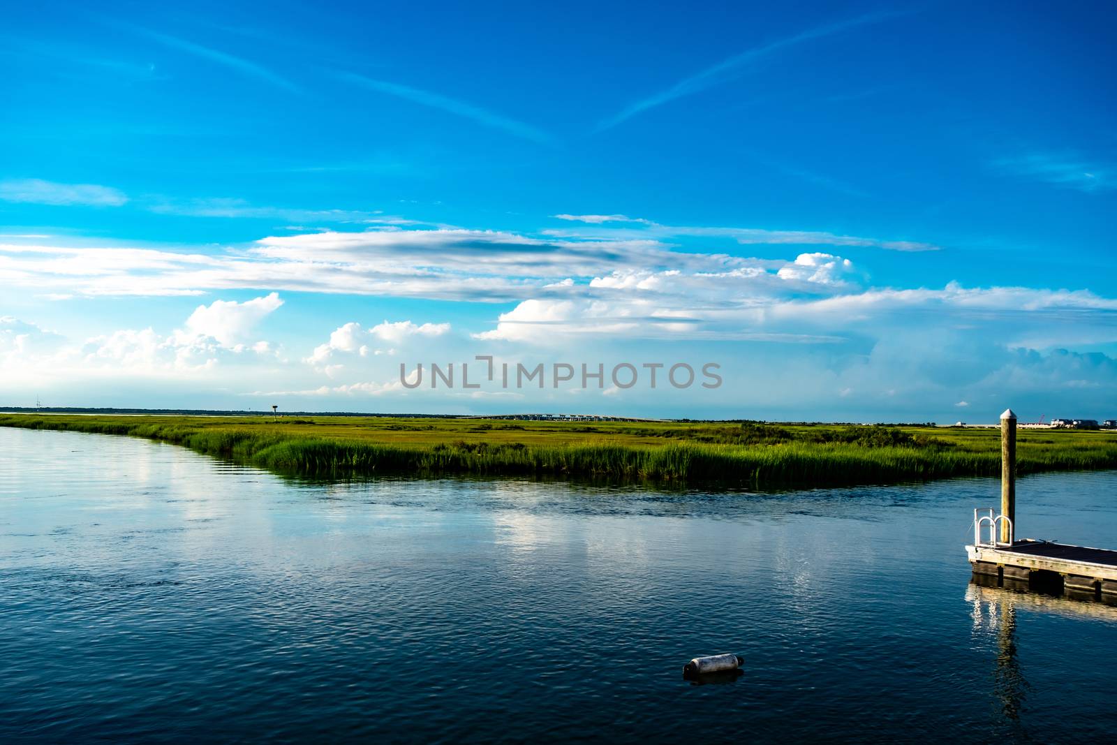 A View of the Bay at Wildwood New Jersey With a Small Dock and a by bju12290