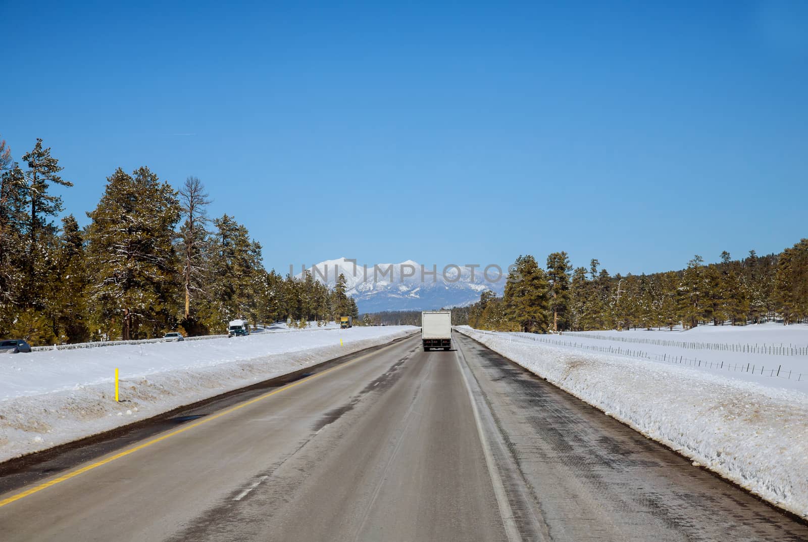 Panoramic view in a Colorado country, in winter on highway road with snow covered landscape