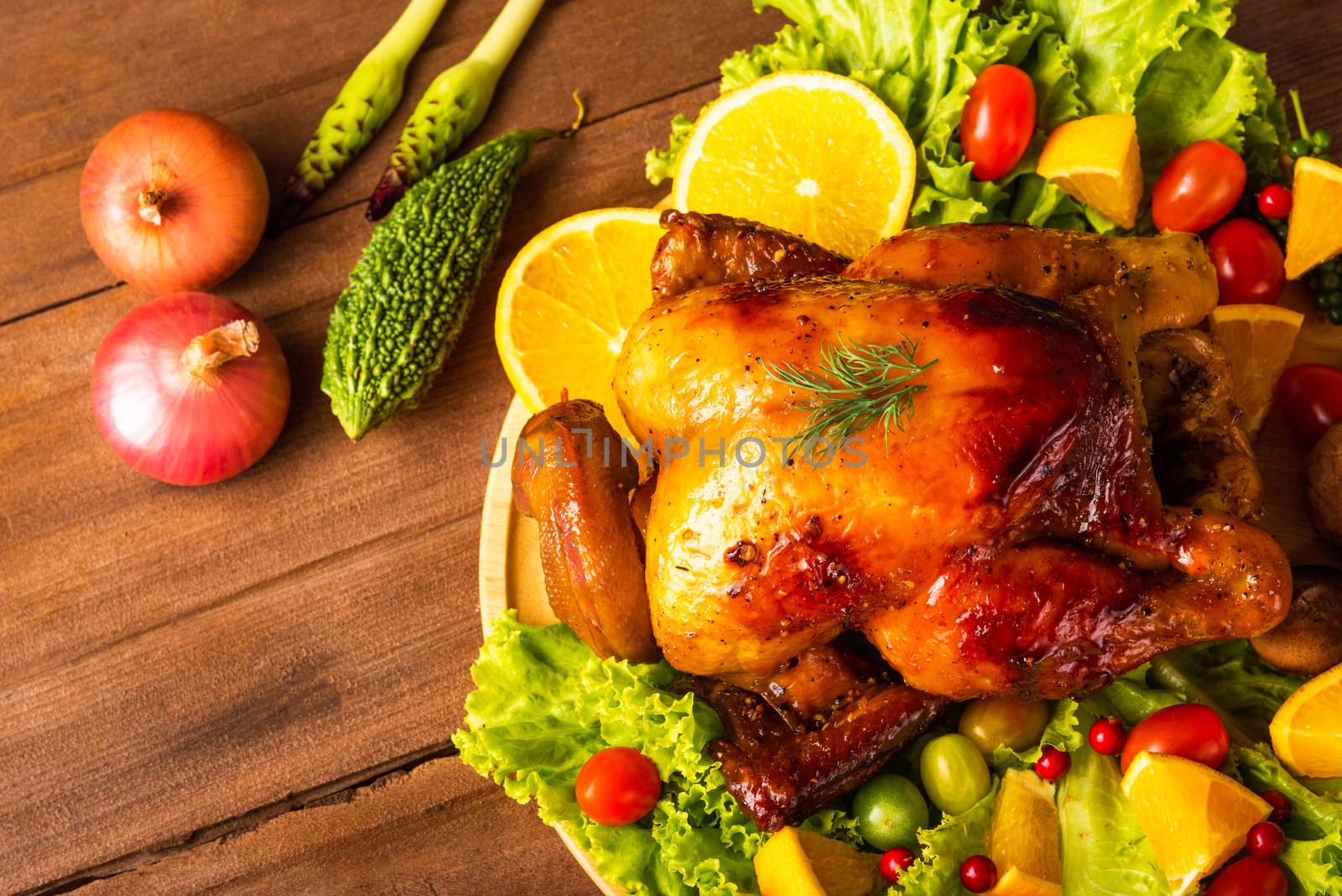 Thanksgiving roasted turkey or chicken and vegetables, Top view Christmas dinner feast food decoration traditional homemade on wooden table background, Happy thanksgiving day of holiday concept