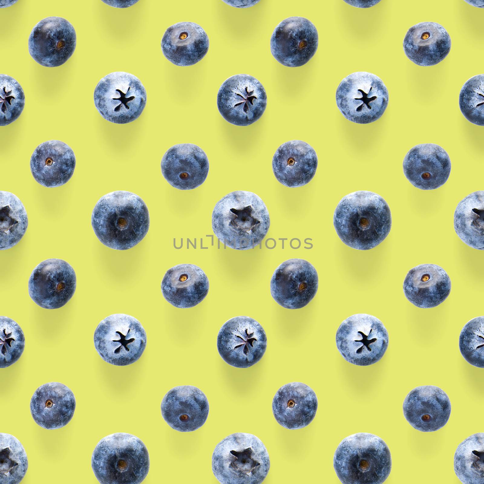 Trendy seamless pattern of blueberries. Blueberry pattern isolated on green background. Blueberry flat lay, can be used for textile, prints, packing designs orother moden andcreative works