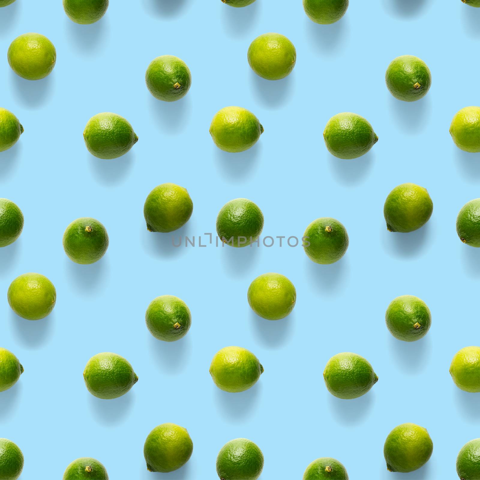 Seamless pattern with green lime. Tropical abstract Seamless pattern background. Fresh ripe Lime on the blue background.