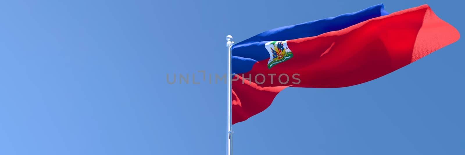 3D rendering of the national flag of Haiti waving in the wind against a blue sky