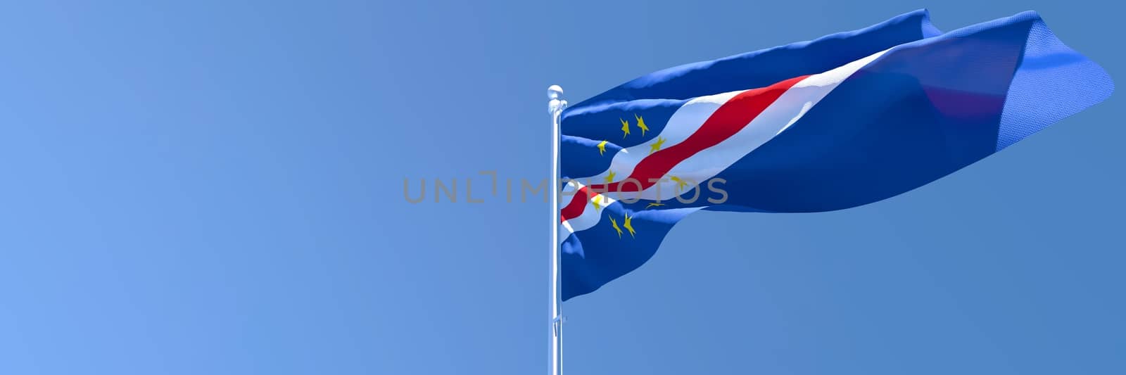 3D rendering of the national flag of Cape Verde waving in the wind against a blue sky