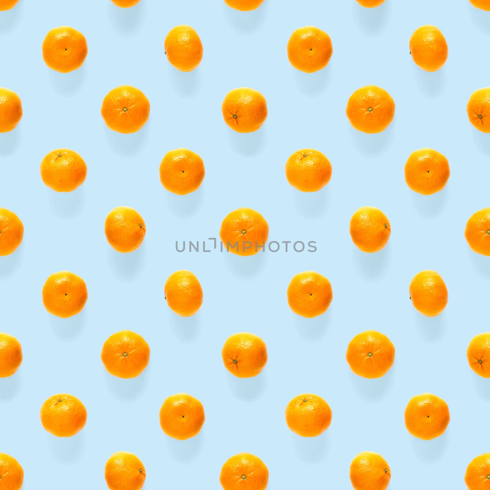 Fresh mandarin Seamles pattern. Ripe fruit tangerines seamless pattern. Fresh citrus isolated on blue background pattern. Flat lay of Clementine. Mandarine modern tropical seamless background.