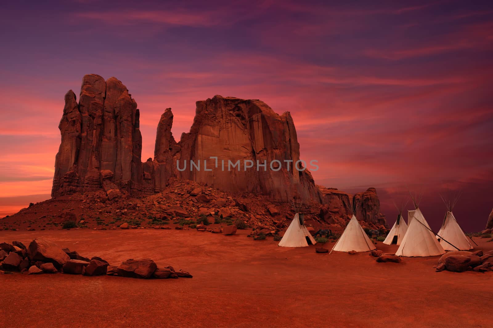 Wigwams/tepees of native Americans in Monument Valley at sunset, Arizona-Utah border, USA