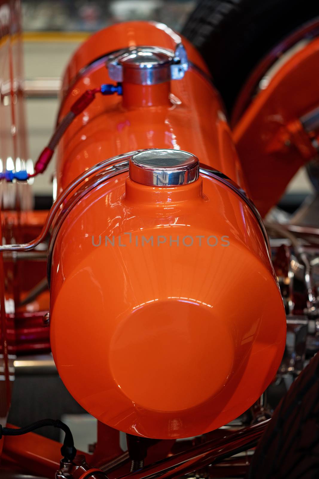 Close up of red classic car hot rod fuel tank cylinder and cap