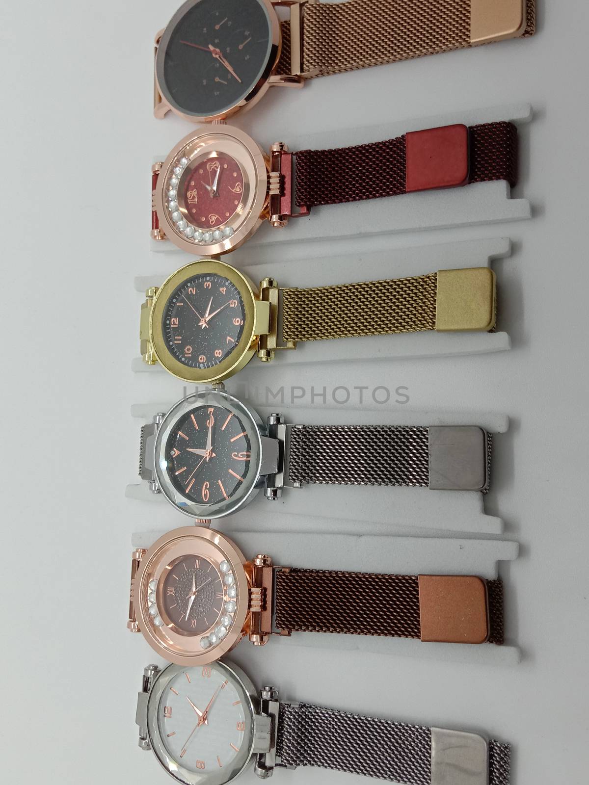 multiple colored watch stock on gray background