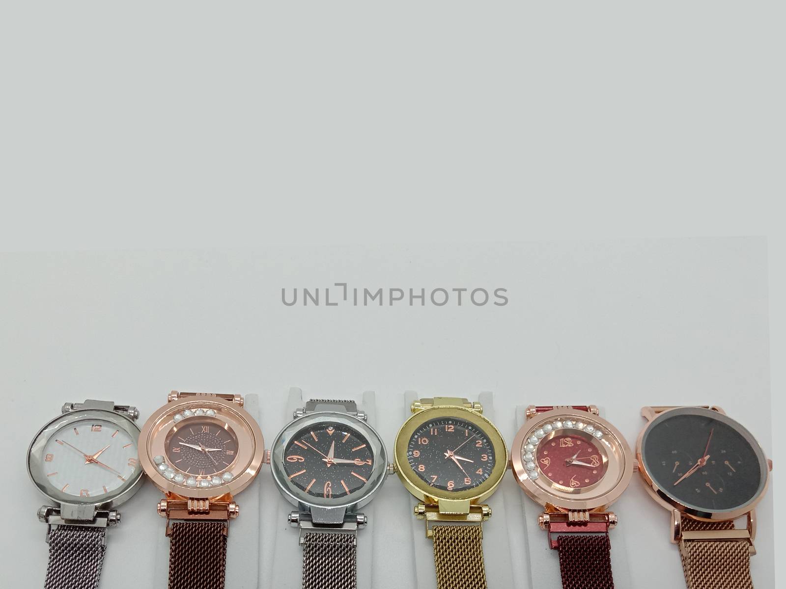 multiple colored watch stock on gray background